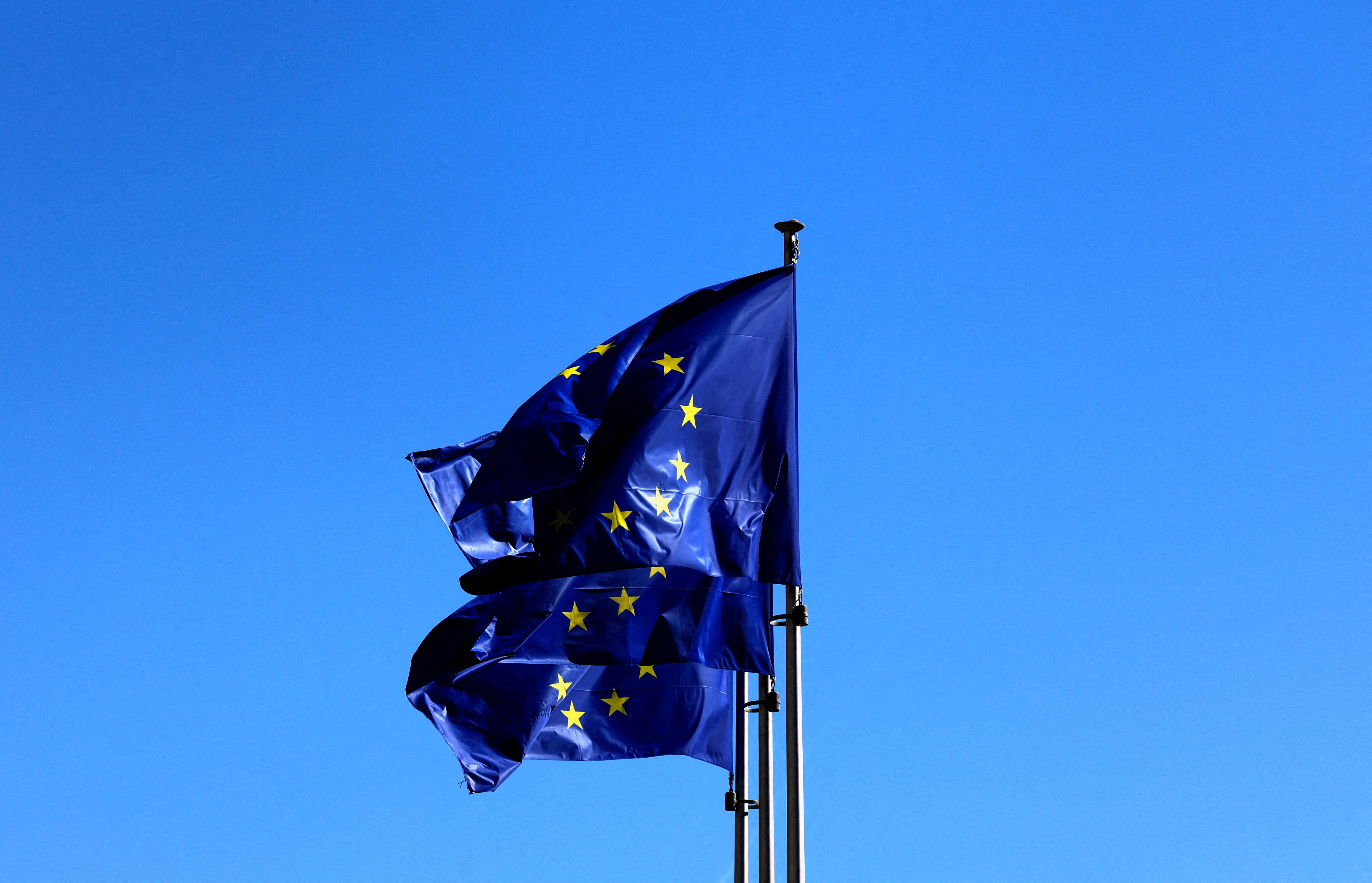 FILE PHOTO: FILE PHOTO: European Union flags flutter outside the EU Commission headquarters in Brussels