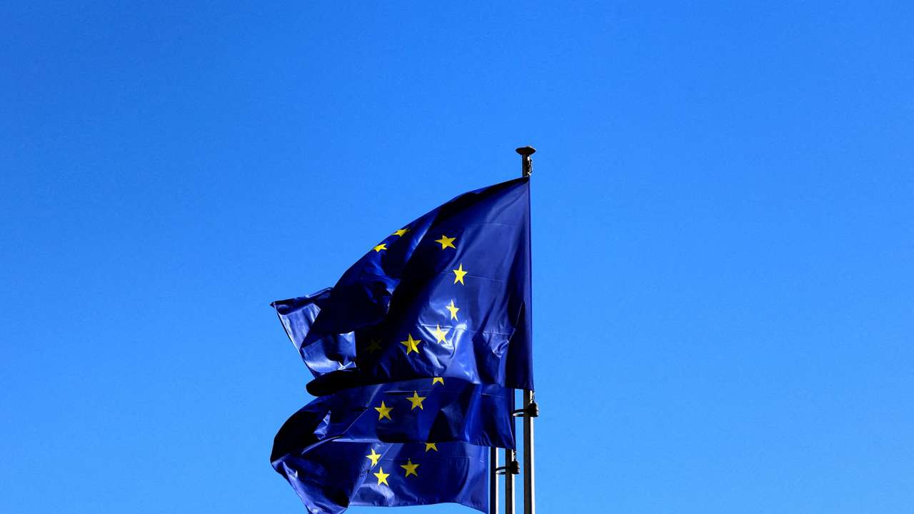 FILE PHOTO: FILE PHOTO: European Union flags flutter outside the EU Commission headquarters in Brussels