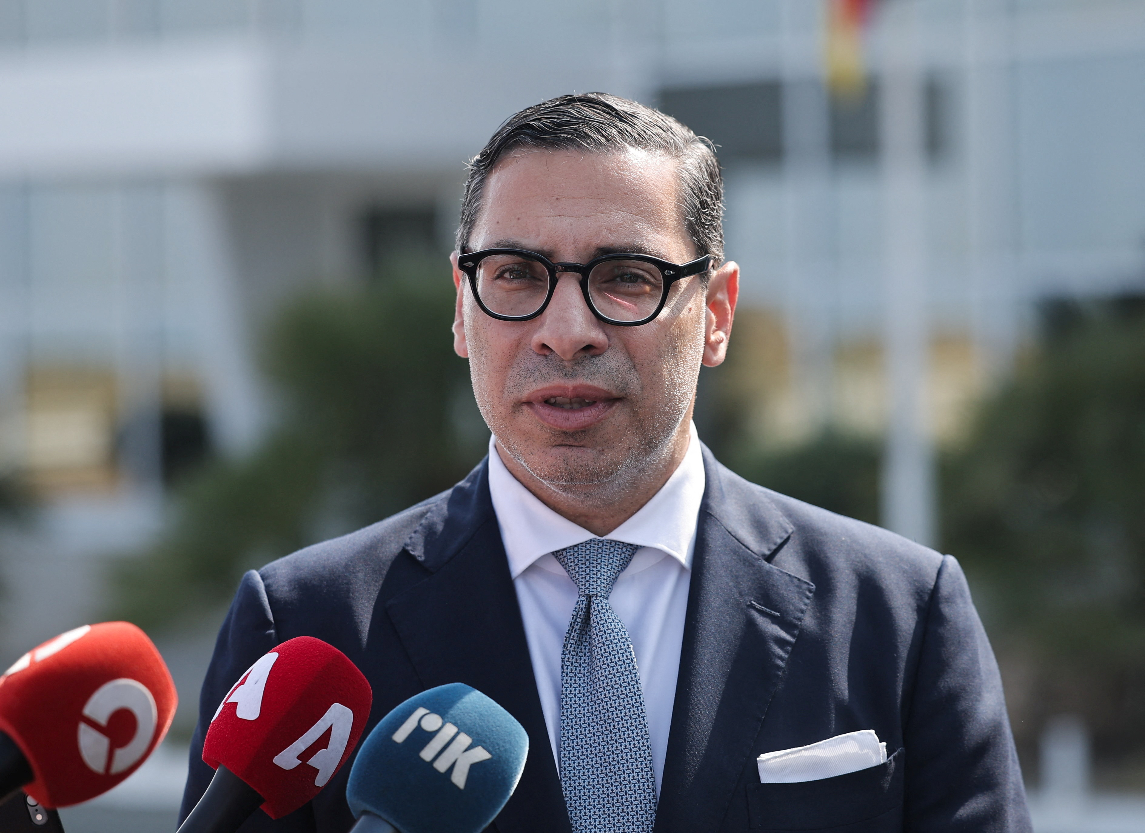Cypriot Foreign Minister Kombos speaks to the media after a meeting with Germany's Foreign Minister Wadephul at the Larnaca International Airport, in Larnaca
