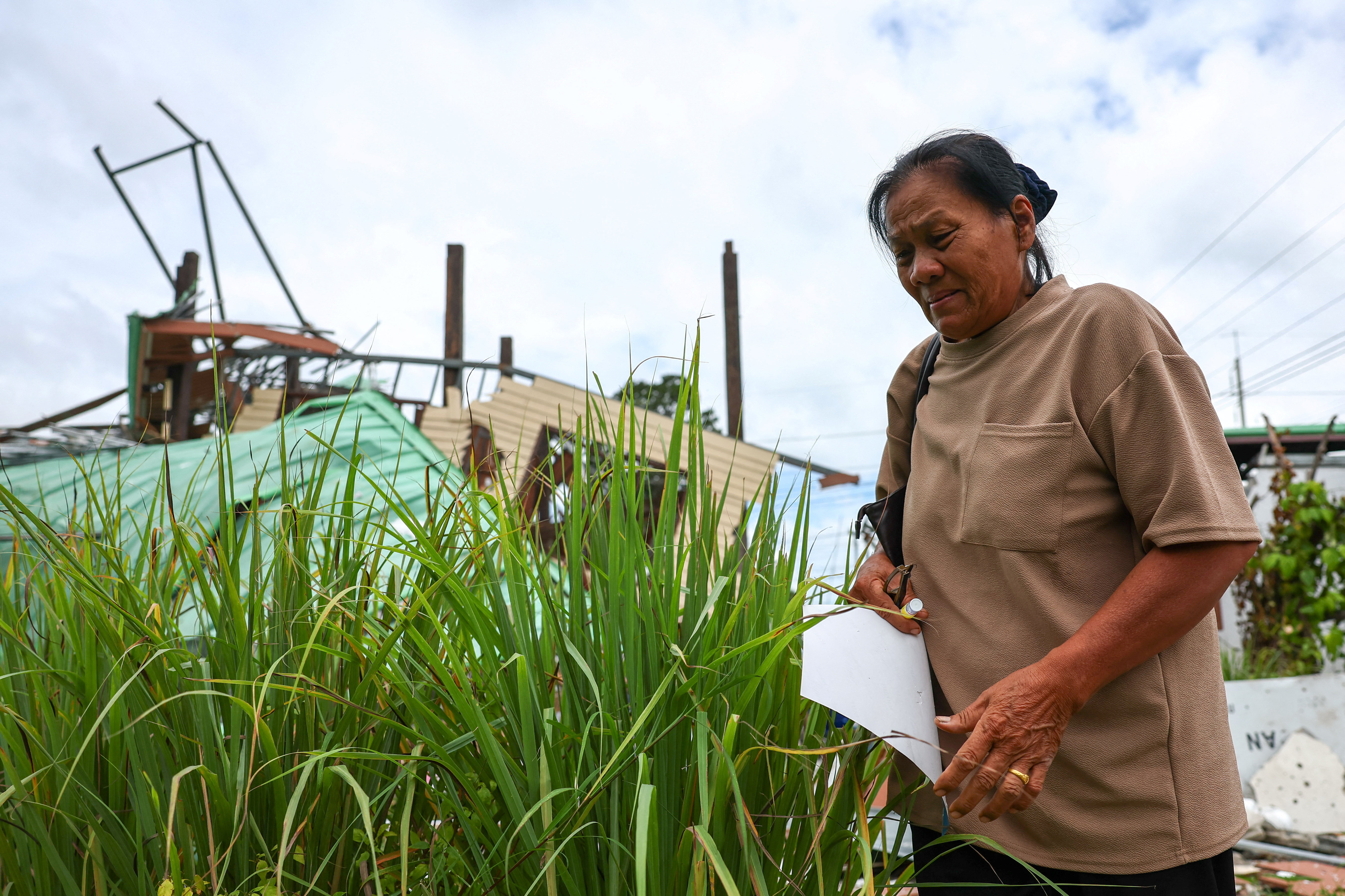 'Thank God, we fled': Thai grandmother returns to ruins after border conflict