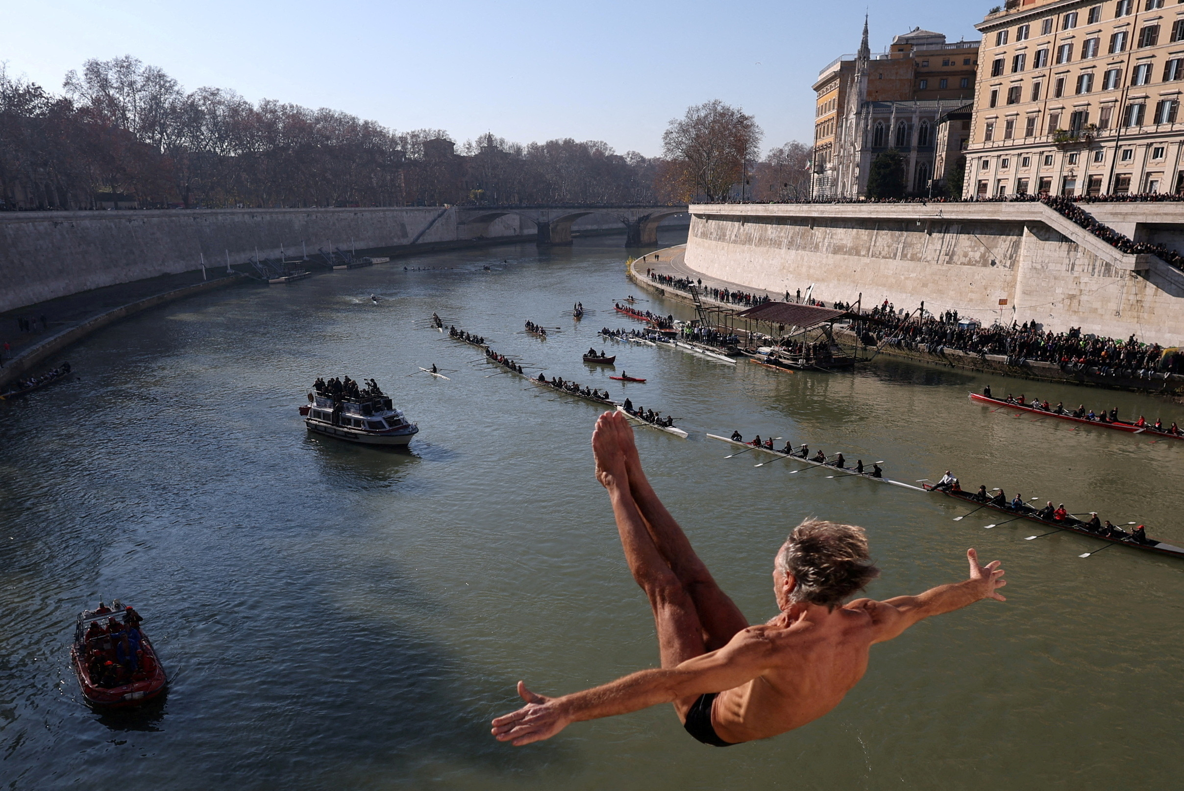 FILE PHOTO: Traditional New Year's diving into the Tiber River in Rome