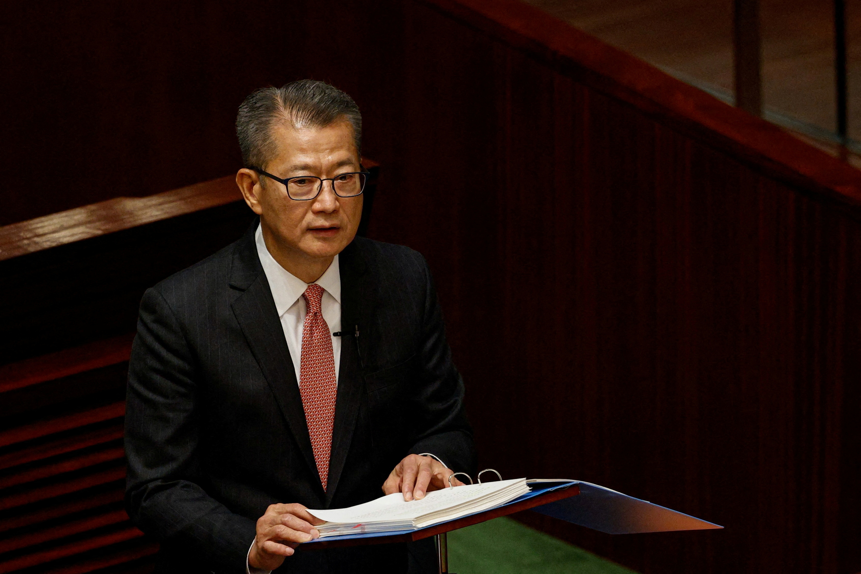 FILE PHOTO: Hong Kong's Finance Secretary Paul Chan delivers the annual budget address at the Legislative Council in Hong Kong