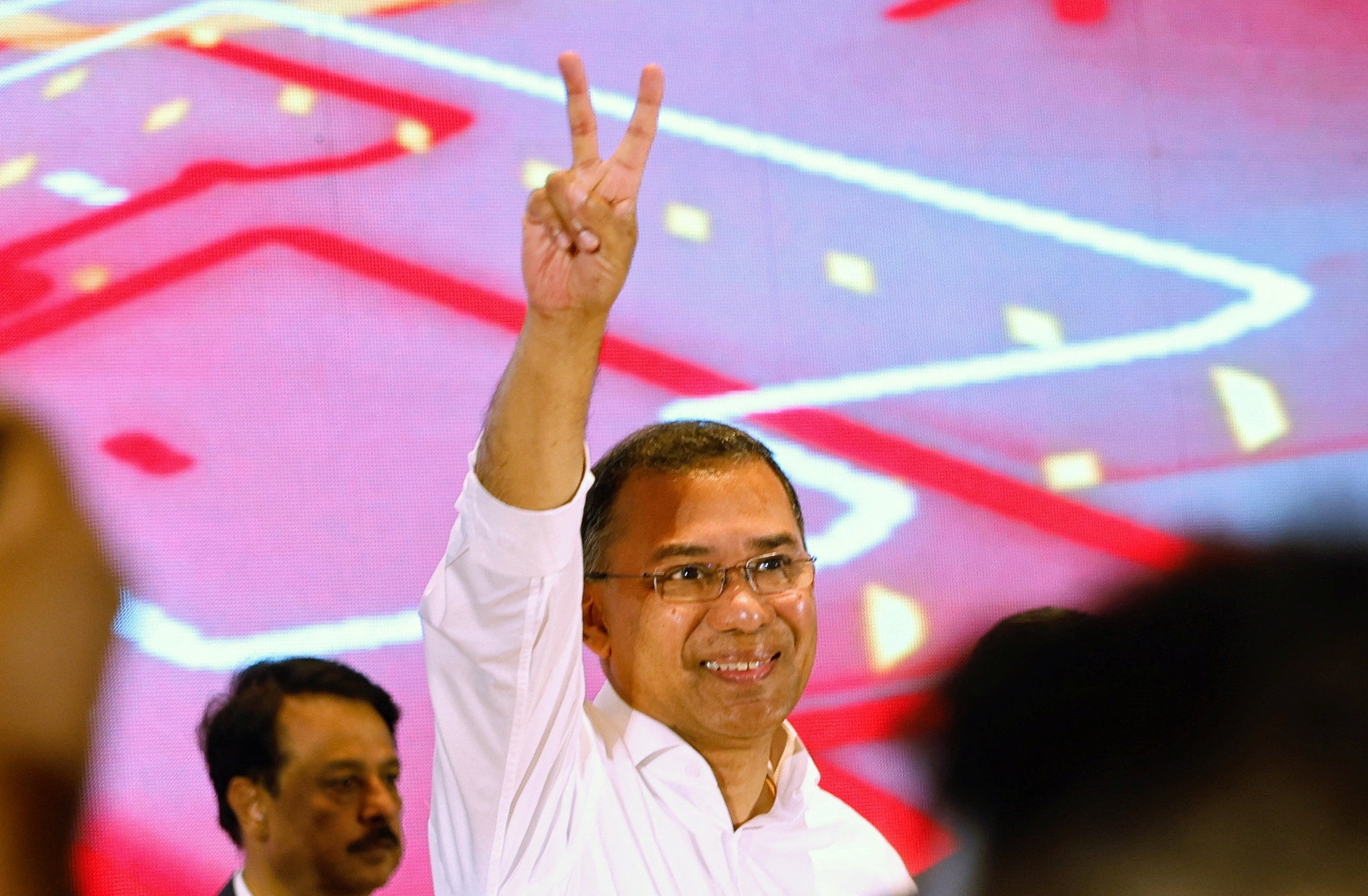 Tarique Rahman, chairman of Bangladesh Nationalist Party (BNP), shows victory sign during a press conference, following the victory on 13th general election, in Dhaka