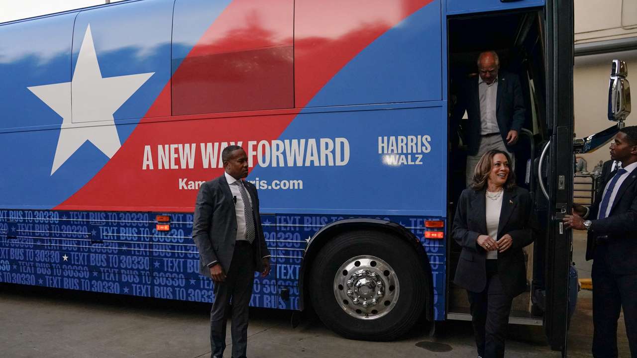 Harris and Walz step off a campaign bus after multiple stops, in Savannah