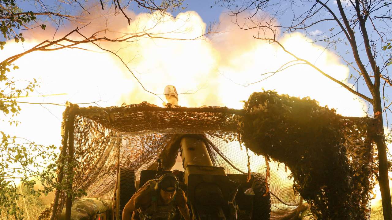 Ukrainian serviceman fires a howitzer towards Russian troops in a front line in Donetsk region