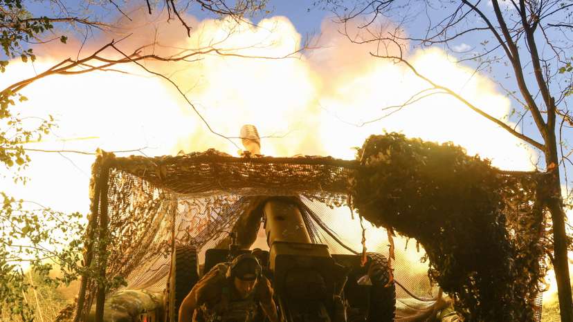 Ukrainian serviceman fires a howitzer towards Russian troops in a front line in Donetsk region