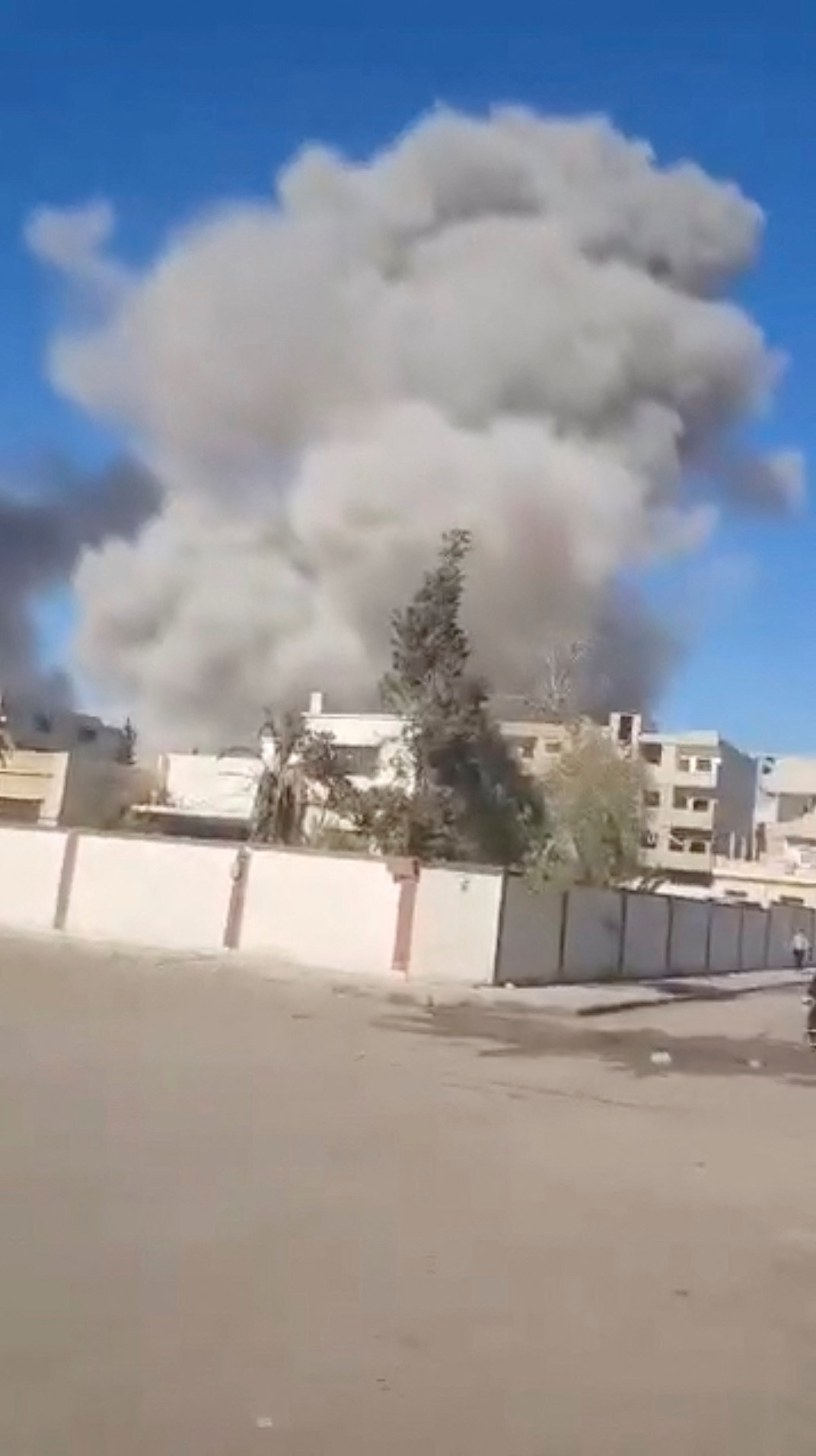 Smoke billows following an explosion after an attack on the historic city of Palmyra