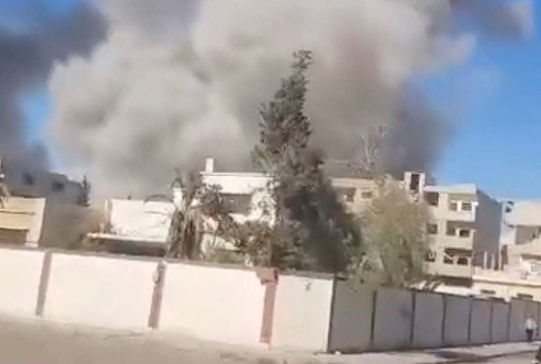 Smoke billows following an explosion after an attack on the historic city of Palmyra