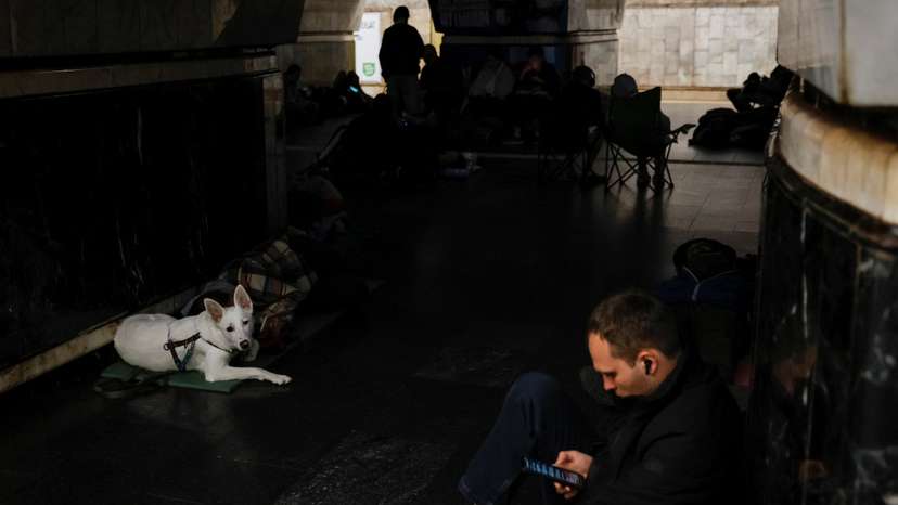 People take shelter inside a metro station during a Russian military attack, in Kyiv