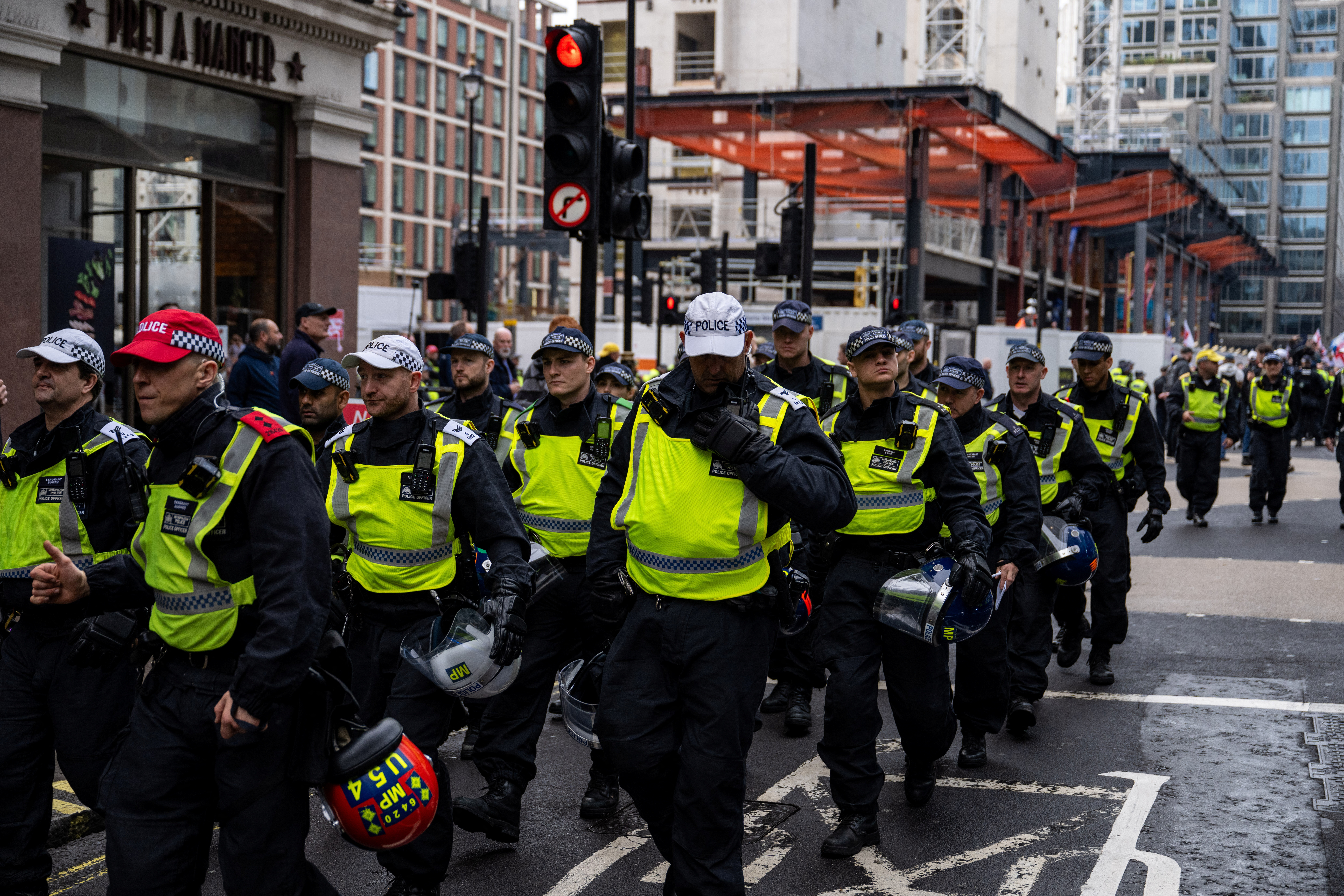 Police patrol during an anti-immigration protest, in London