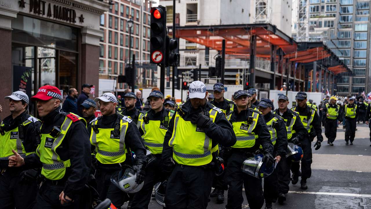 Police patrol during an anti-immigration protest, in London