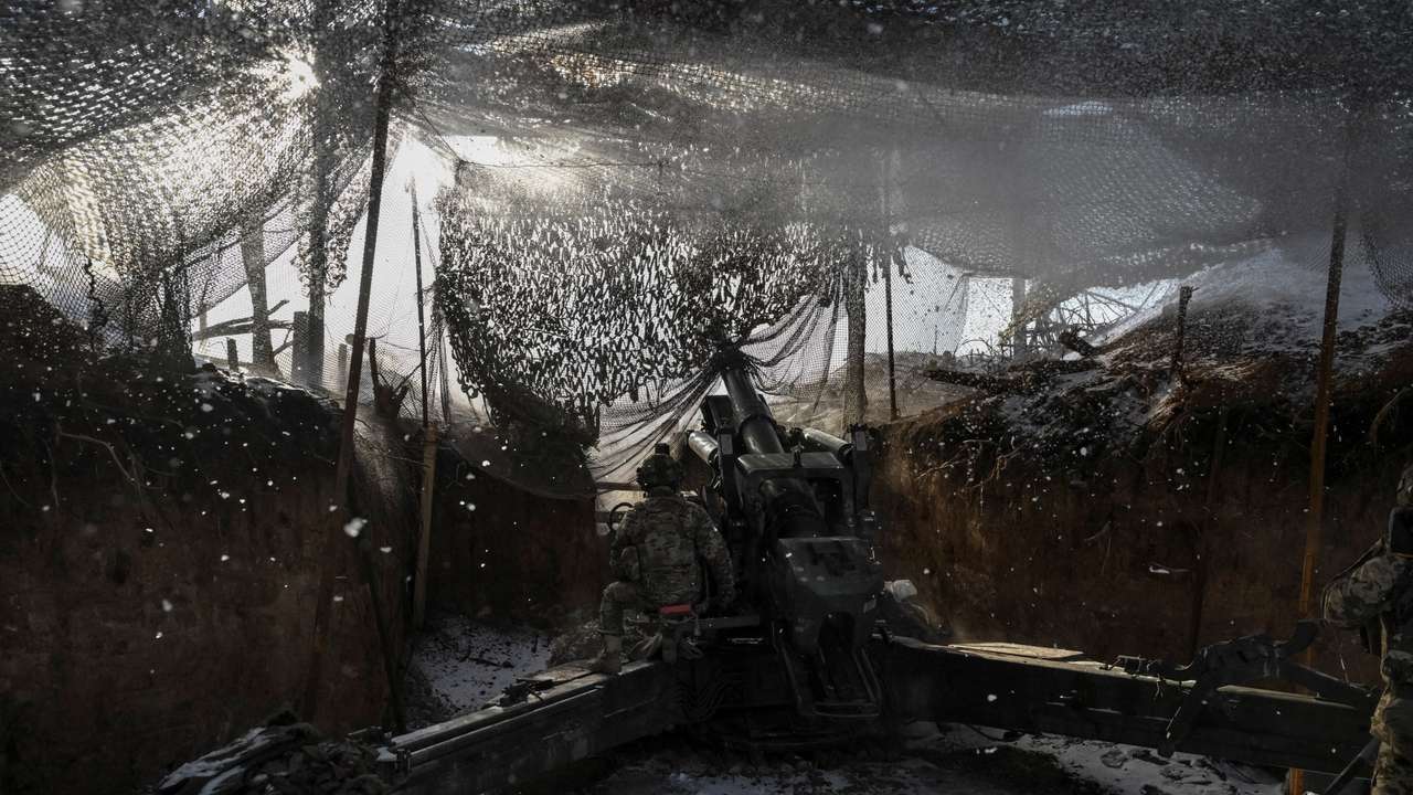 Ukrainian servicemen fire a howitzer towards Russian troops at a frontline in Zaporizhzhia region