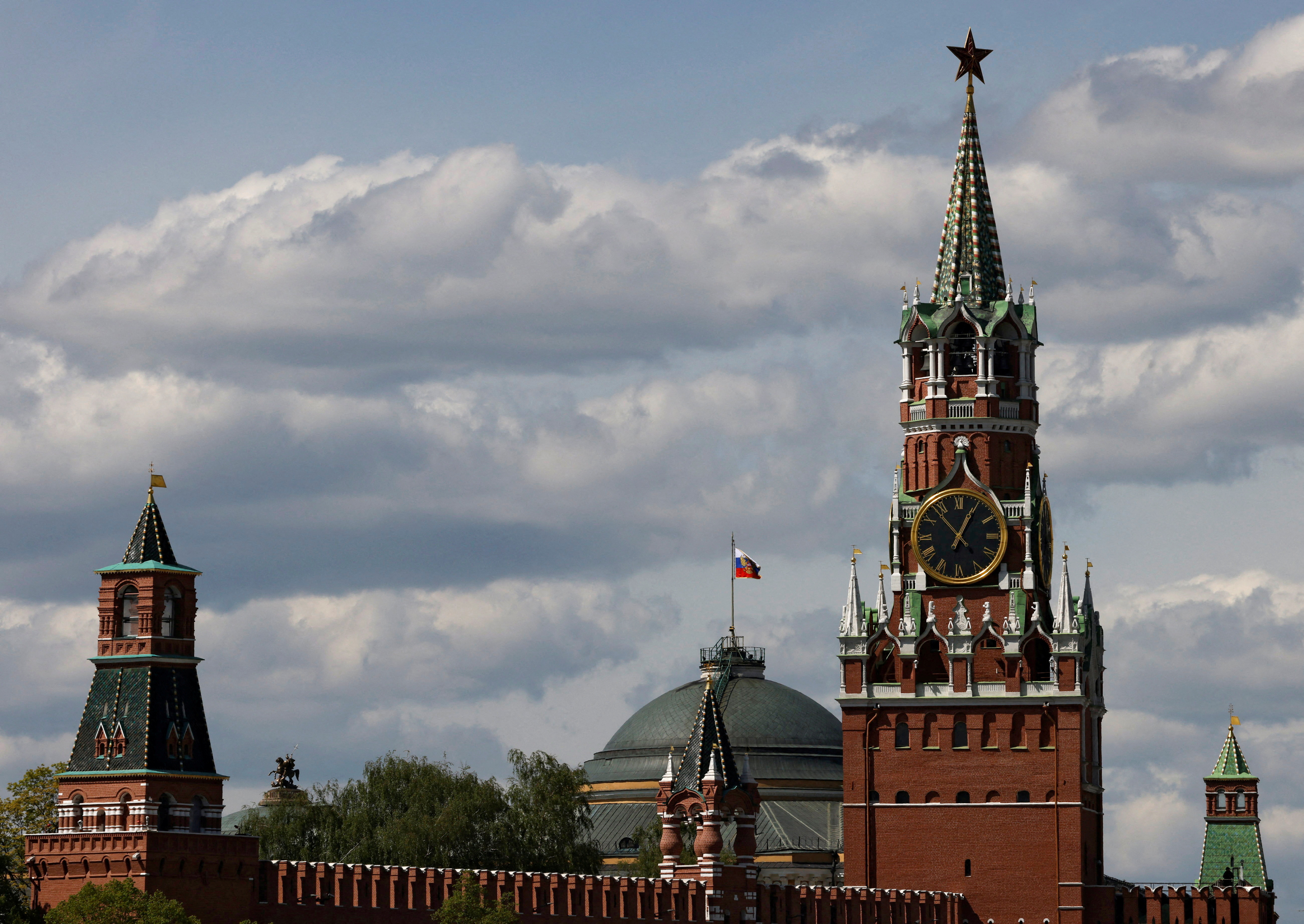 FILE PHOTO: The Russian flag flies on the dome of the Kremlin Senate building in Moscow