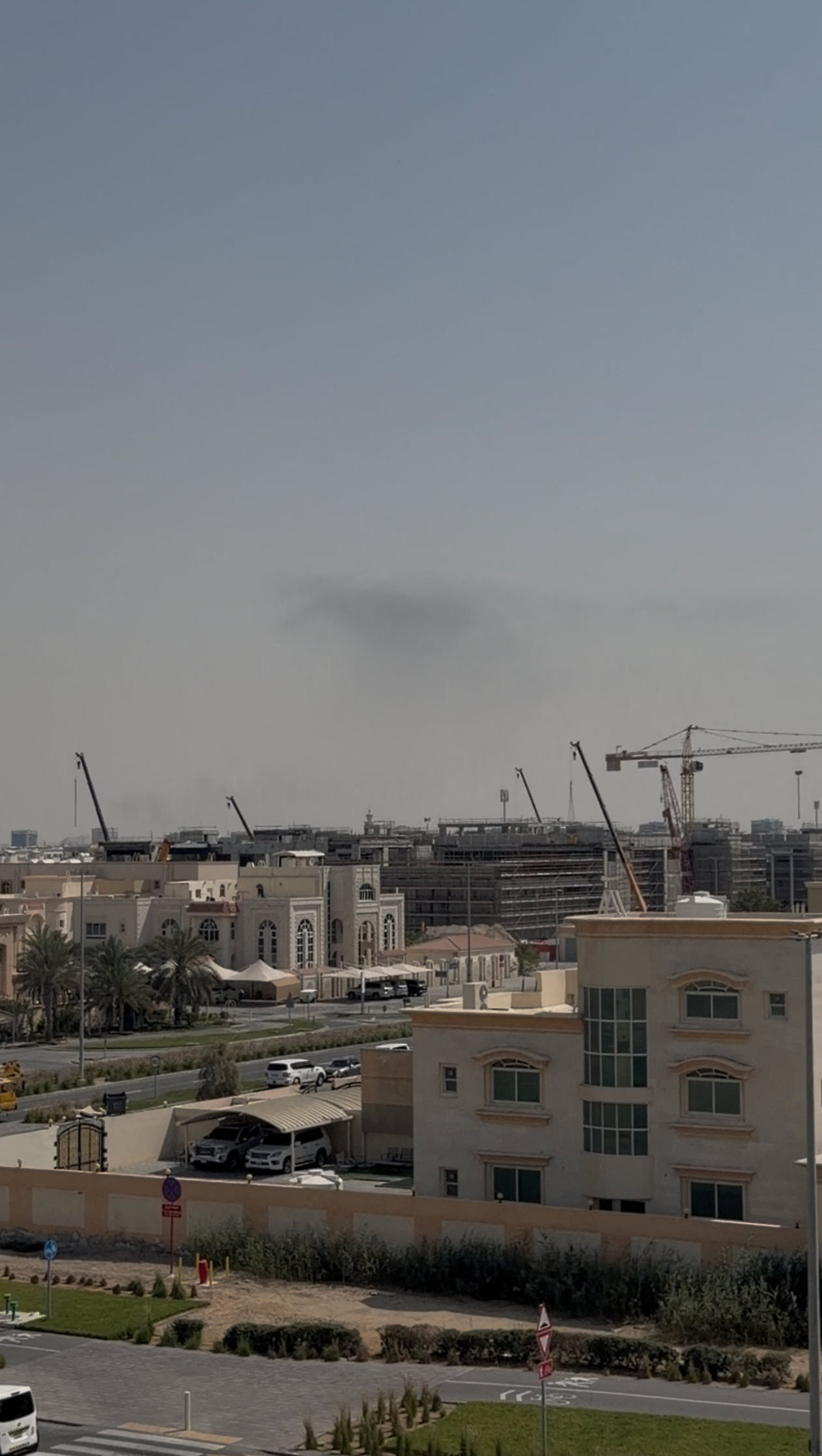 Smoke in the sky after reported blasts were heard, following strikes by the United States and Israel against Iran, in Abu Dhabi