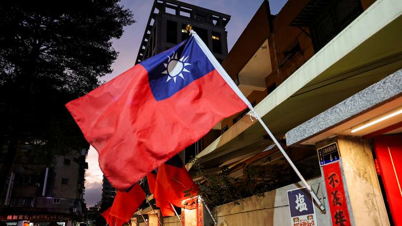 Taiwanese flags are installed along a street, in New Taipei city