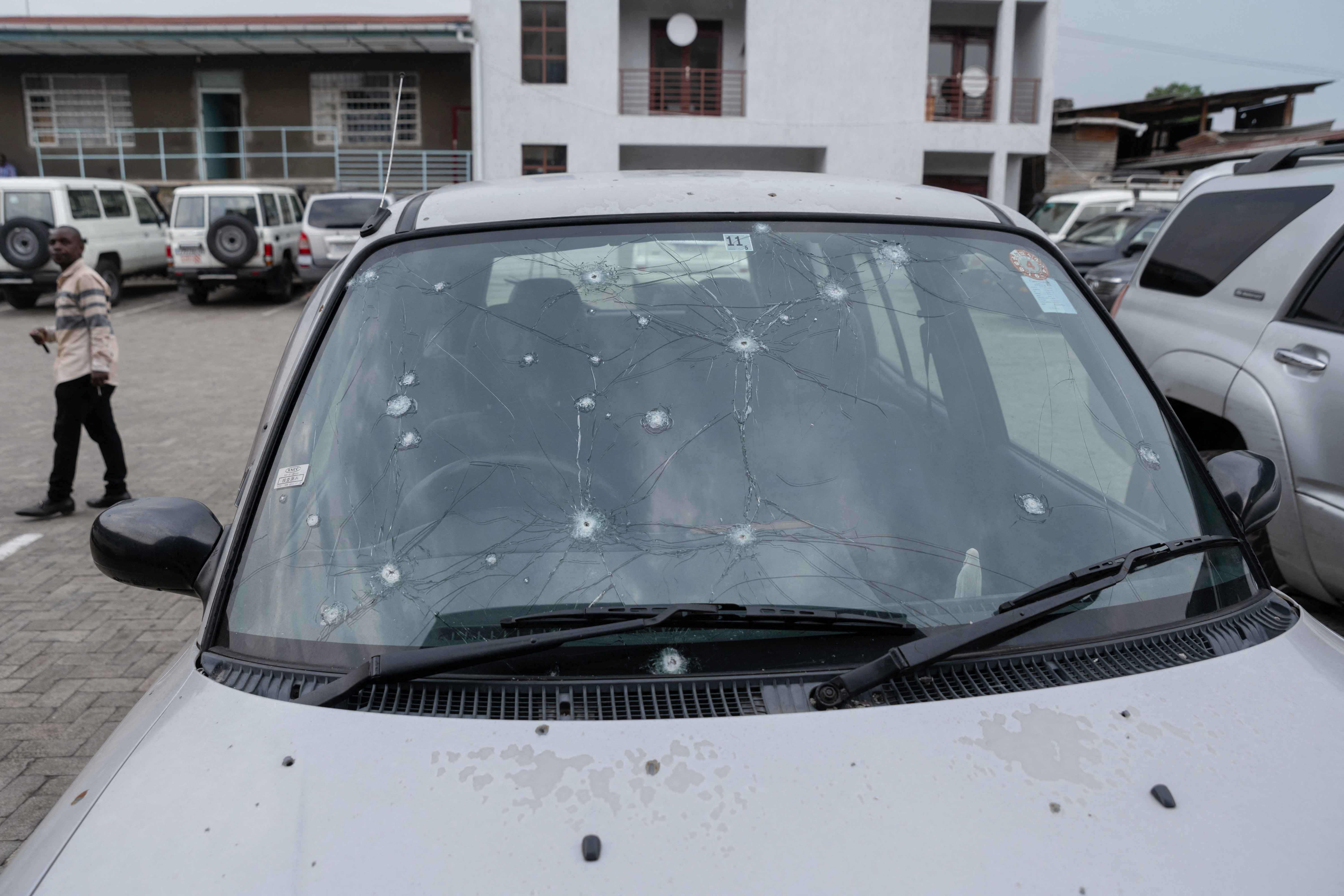 Priest's vehicle sits damaged from fighting in Goma