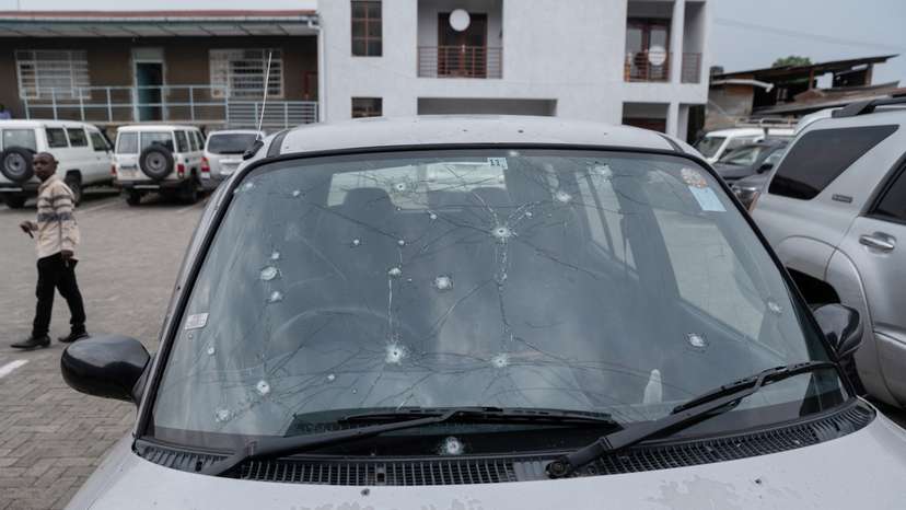 Priest's vehicle sits damaged from fighting in Goma