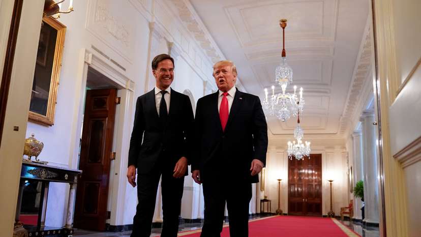 Trump and Netherlands' Prime Minister Rutte take part in a flag presentation at the White House in Washington
