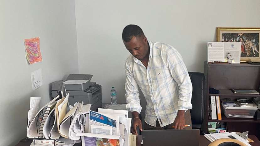 Bansal Oreus helps other Haitian immigrants with government documents at the St. Vincent de Paul Society in Springfield