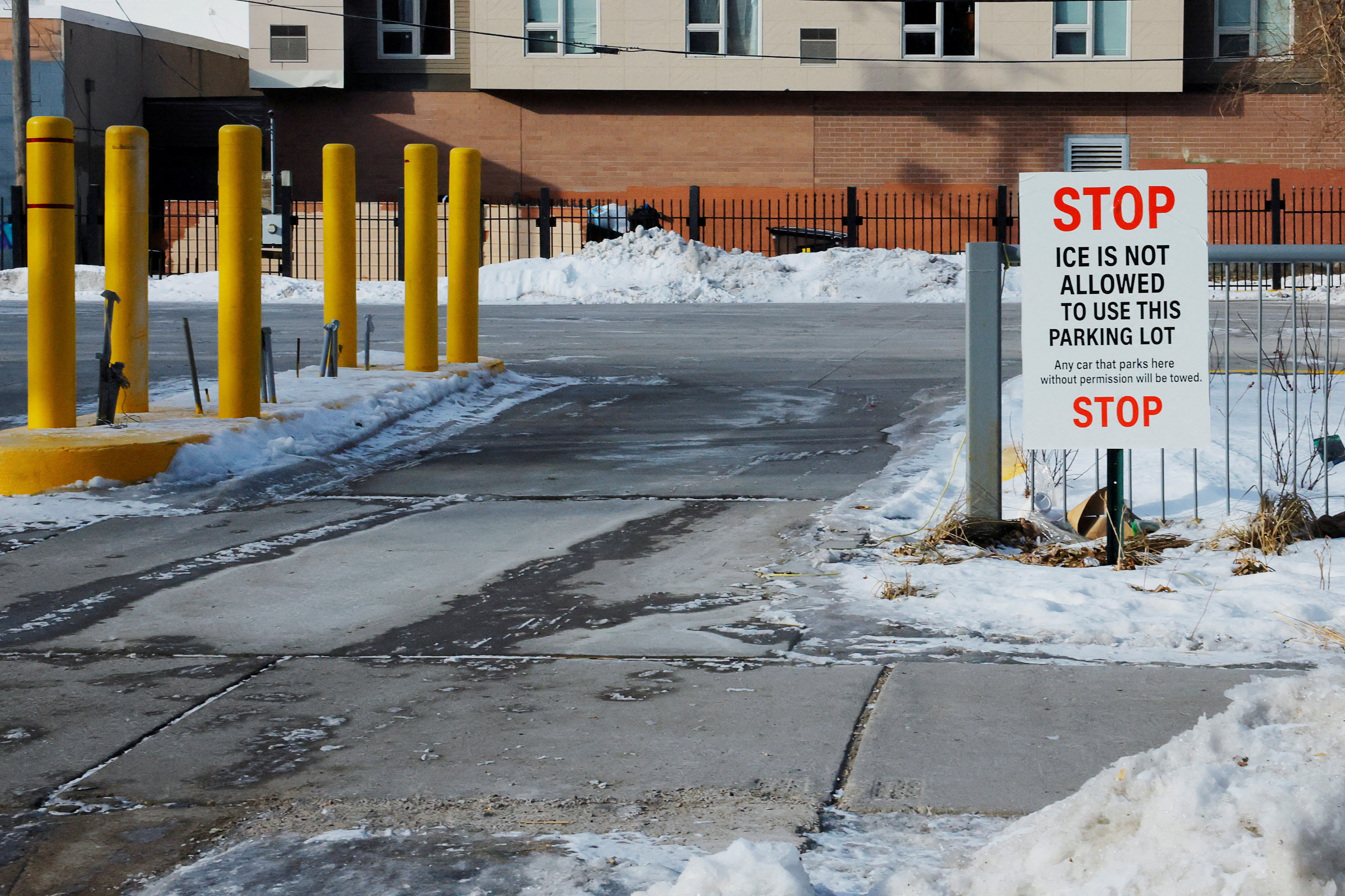 FILE PHOTO: Signs opposing immigration enforcement actions by federal agents hang in Minneapolis