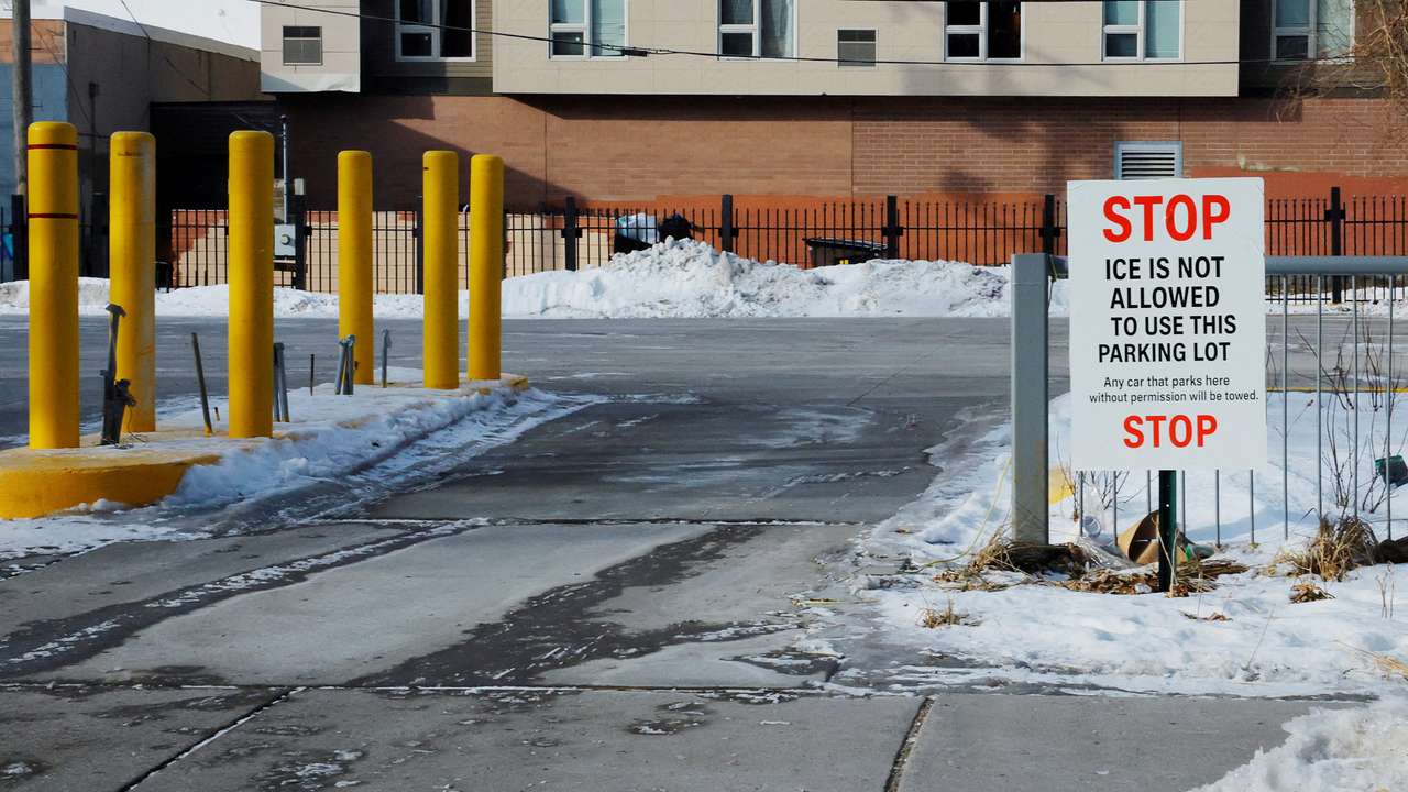 FILE PHOTO: Signs opposing immigration enforcement actions by federal agents hang in Minneapolis