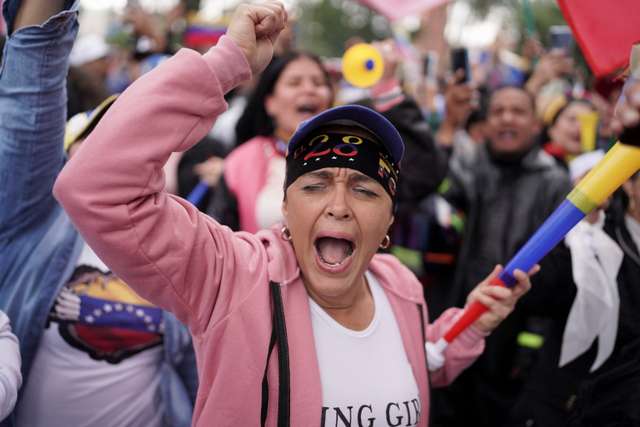Venezuelans cast their vote to elect president, in Bogota