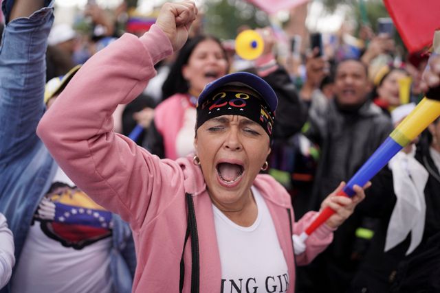 Venezuelans cast their vote to elect president, in Bogota