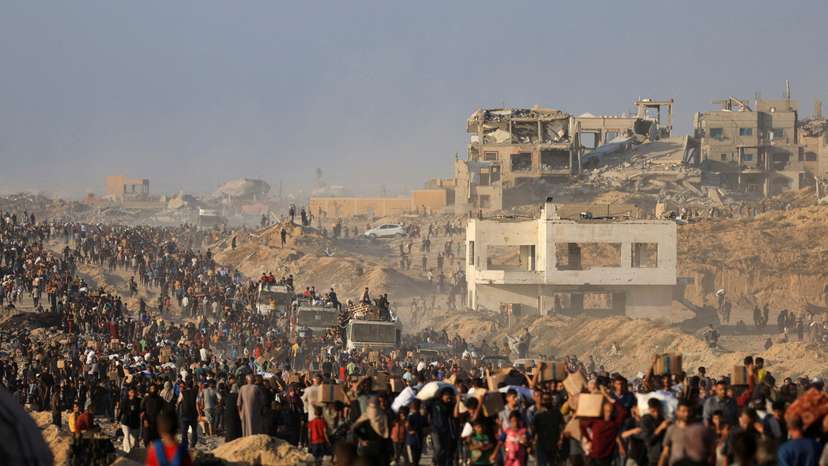 FILE PHOTO: Palestinians receive aid supplies in Beit Lahia