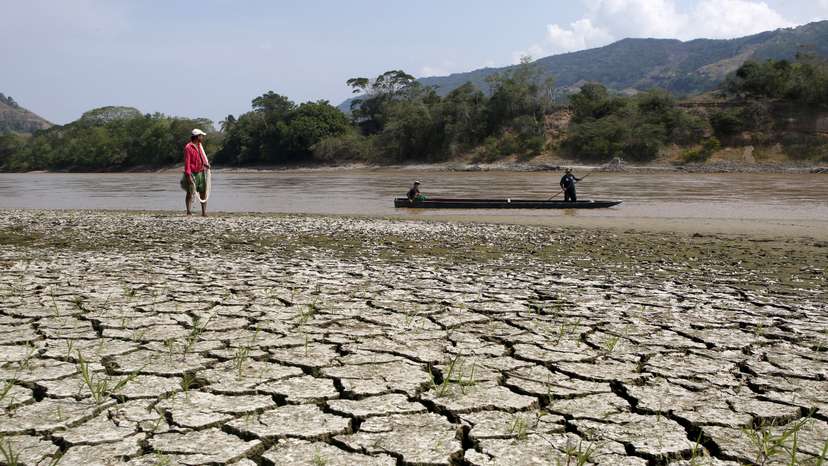 FILE PHOTO: Fisherman Gabriel Barreto stands on the shore of the Magdalena river, the longest and most important river in Colombia, in the city of Honda