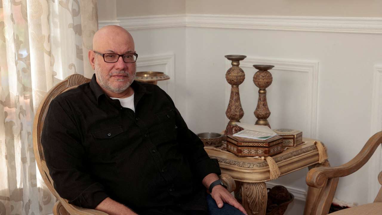 Palestinian American Mohammad Enayah sits for a photo in his home in West Bloomfield, Michigan