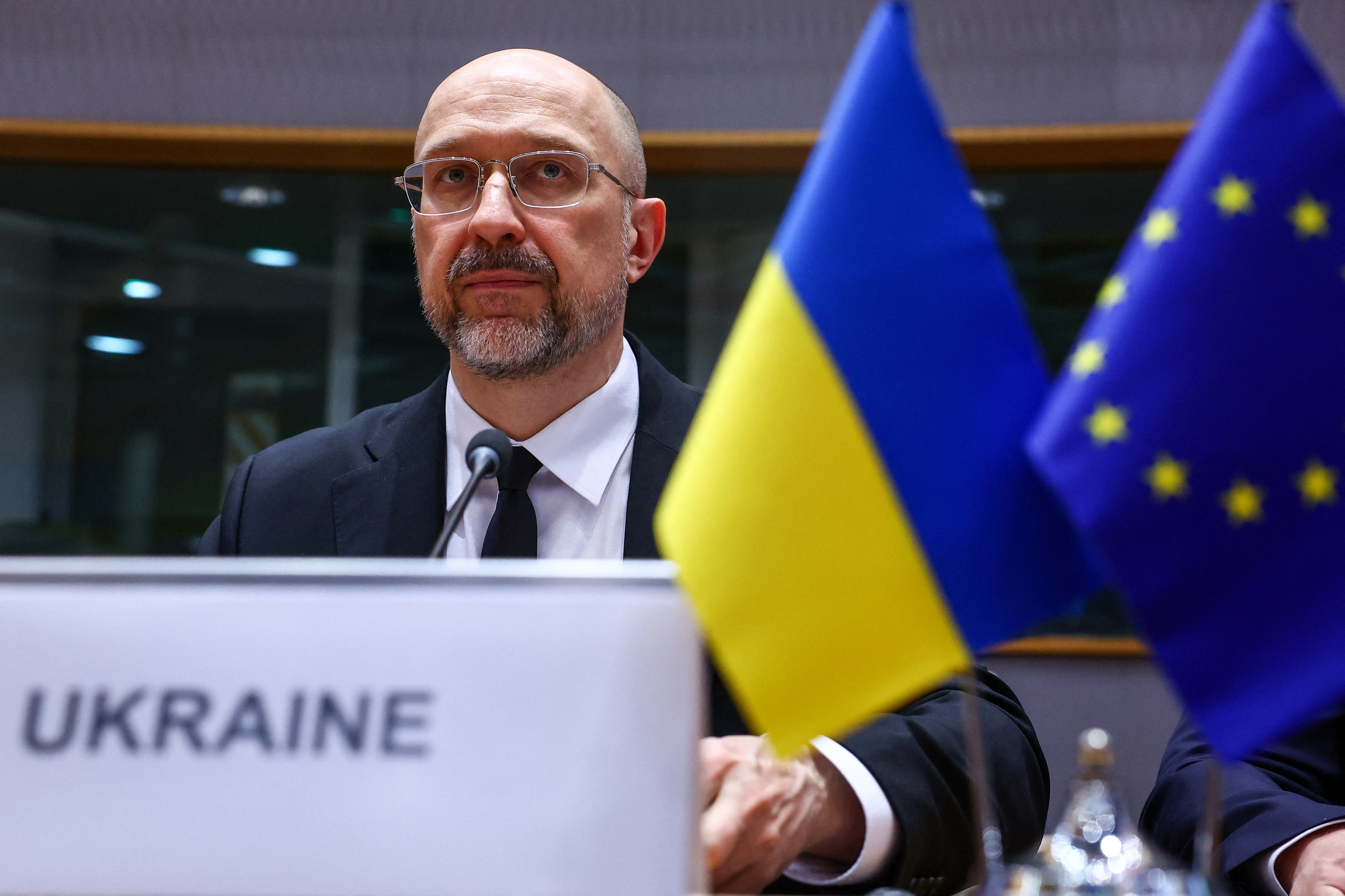 Ukrainian Prime Minister Denys Shmyhal looks on as he takes part in the EU-Ukraine Association Council, in Brussels