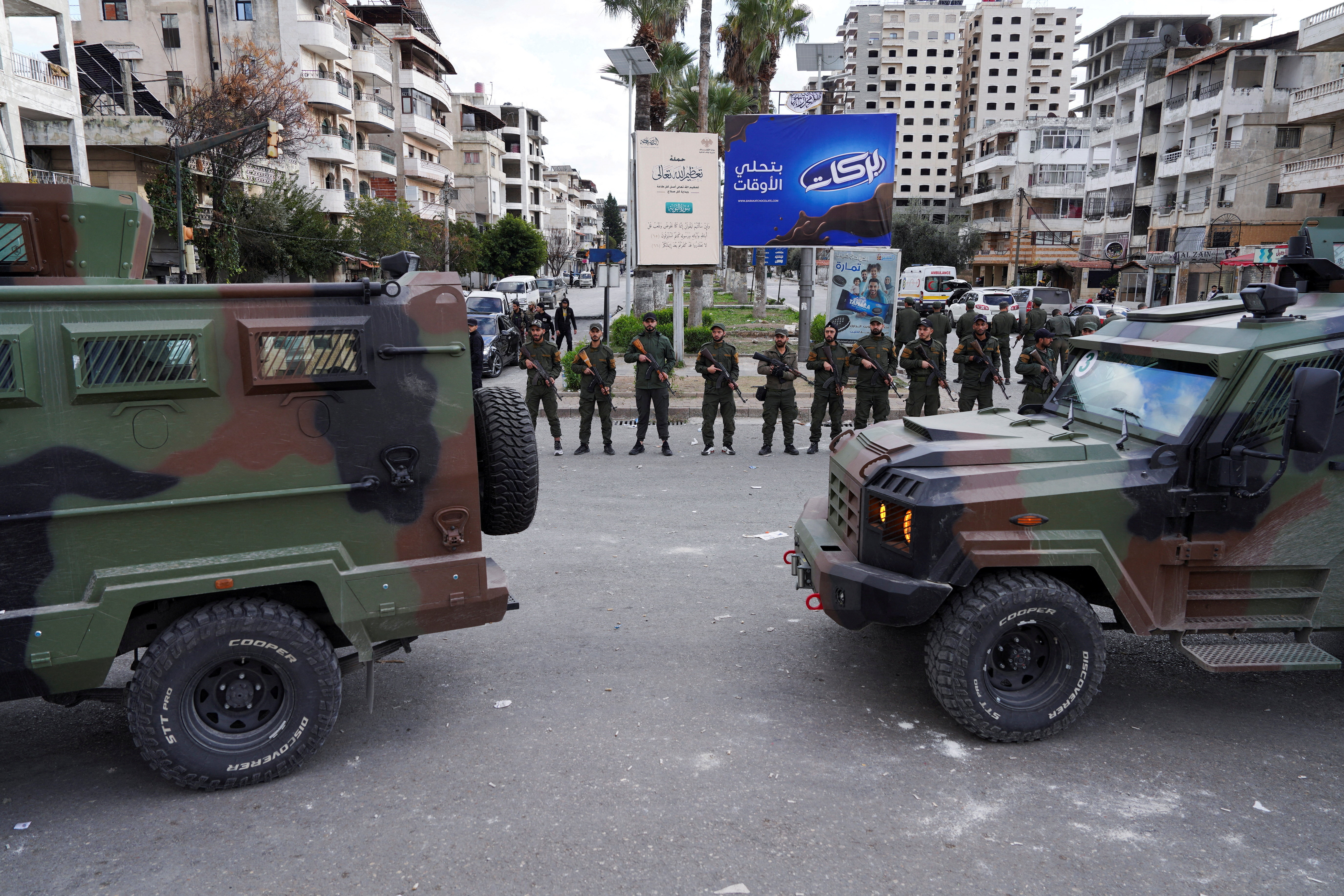 FILE PHOTO: People from the Alawite sect protest as they demand federalism and an end to the killing and violations against Alawites, in Latakia