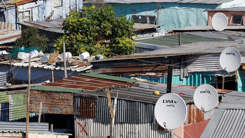 Satellite dishes connect township residents to South Africa's DSTV television network, owned by telecommunications giant Naspers in Khayelitsha township