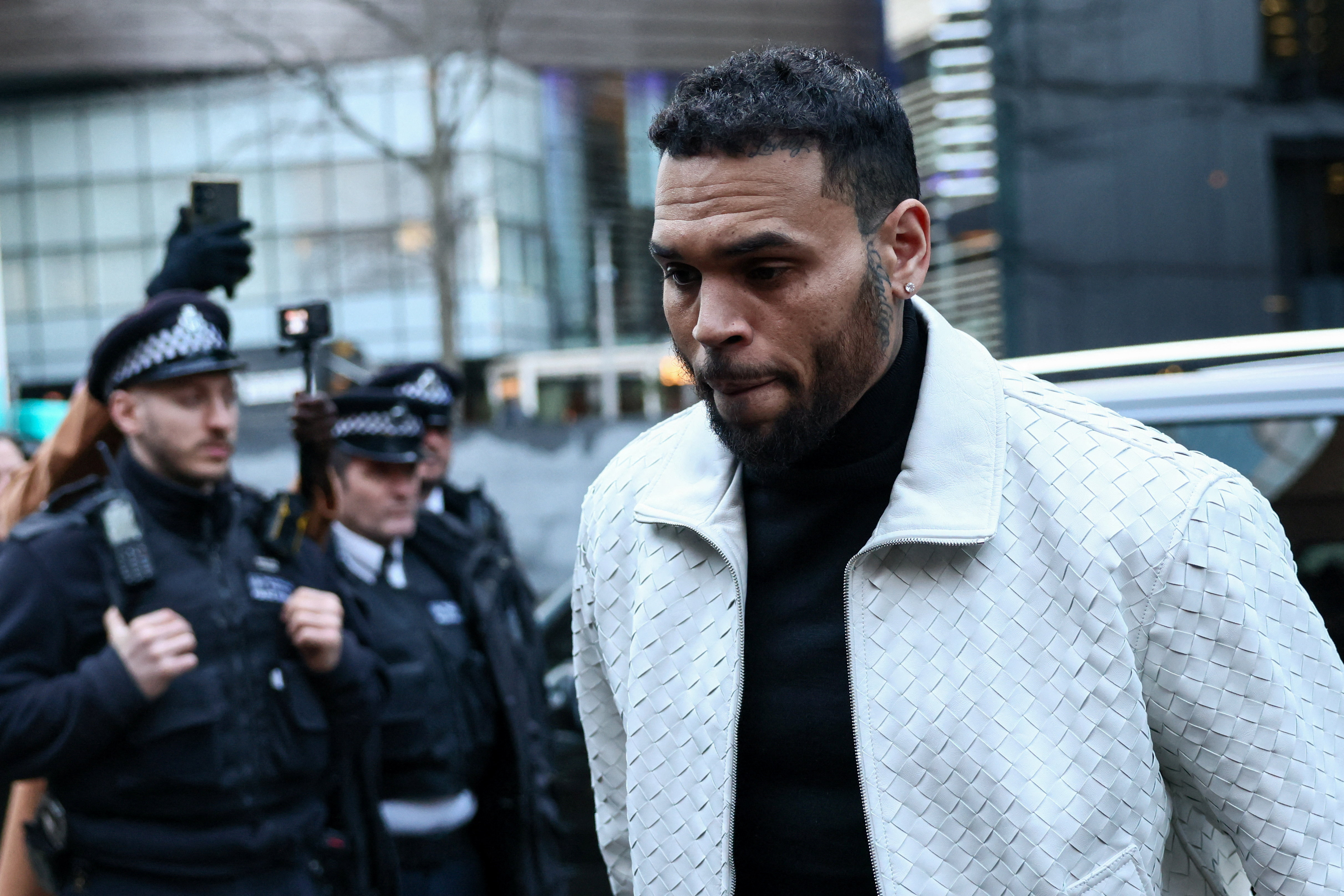 U.S. singer Chris Brown appears outside the Southwark Crown Court, in London