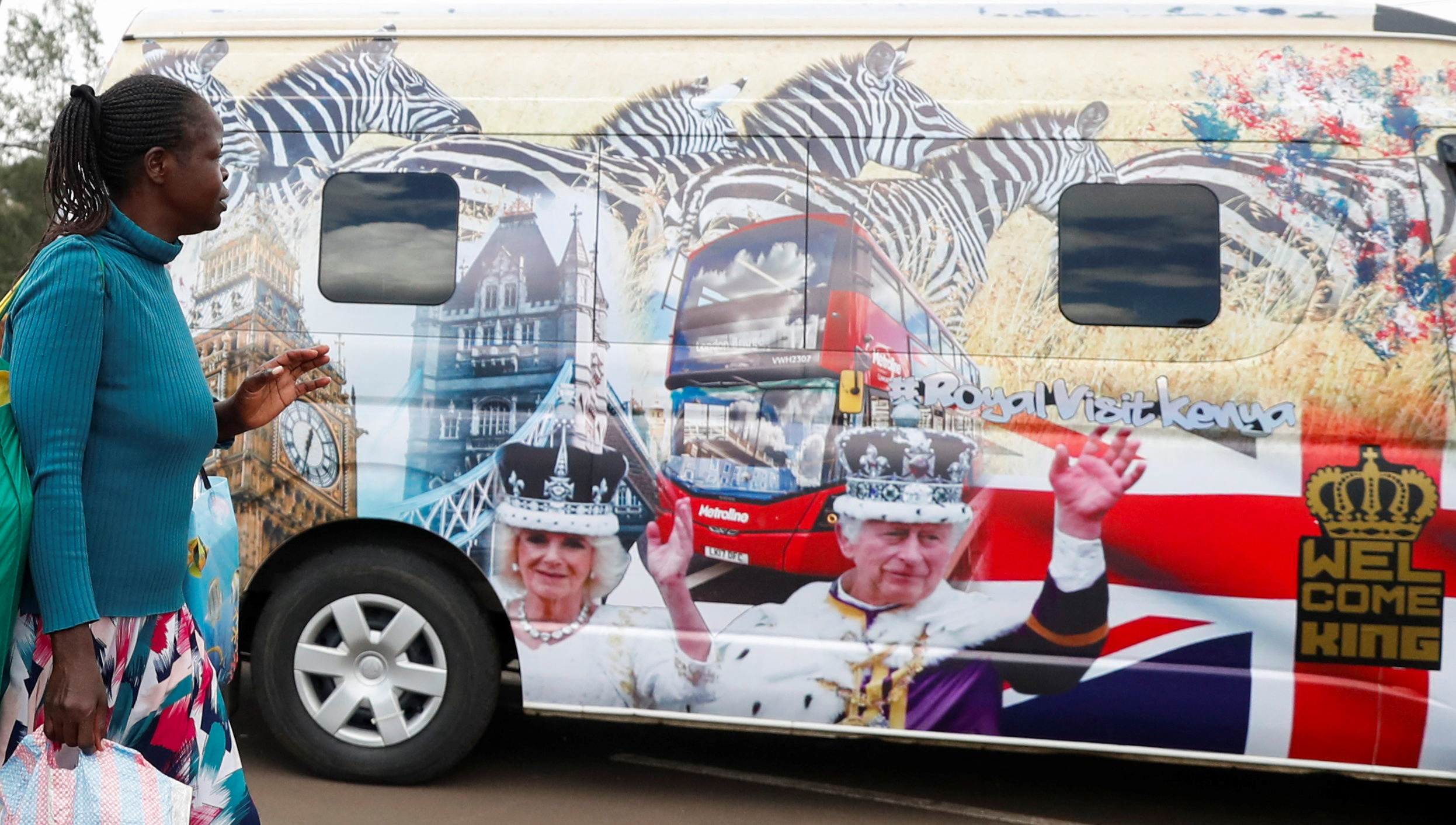 Vans decorated with images of Britain's King Charles and Queen Camilla, in Nairobi