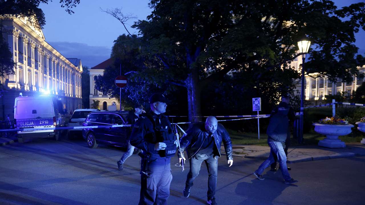 Polish police secure an area at the Warsaw University after an attack with an axe