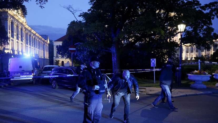 Polish police secure an area at the Warsaw University after an attack with an axe