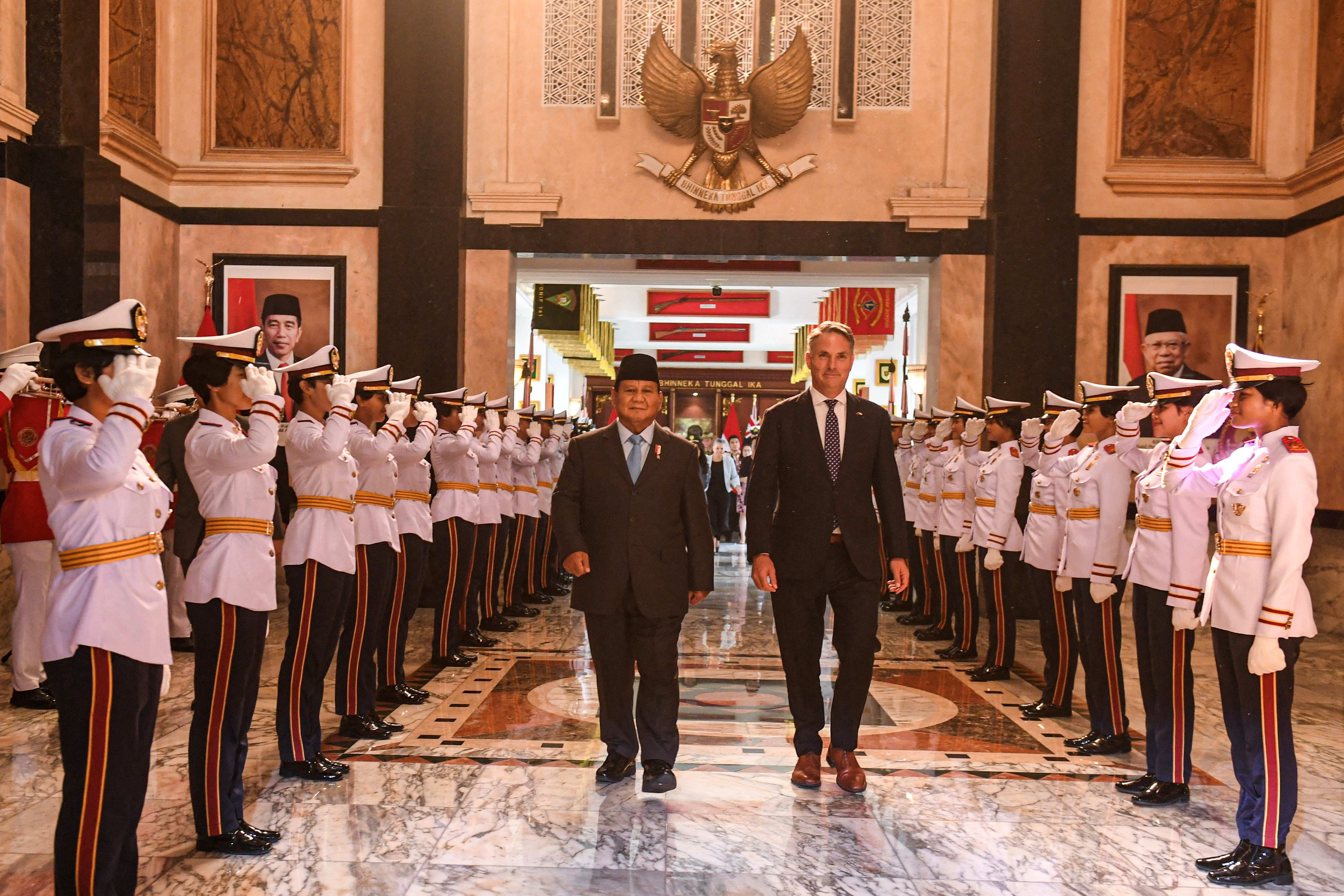 Indonesian Defence Minister Prabowo Subianto walks with Australian Defence Minister Richard Marles after their meeting in Jakarta