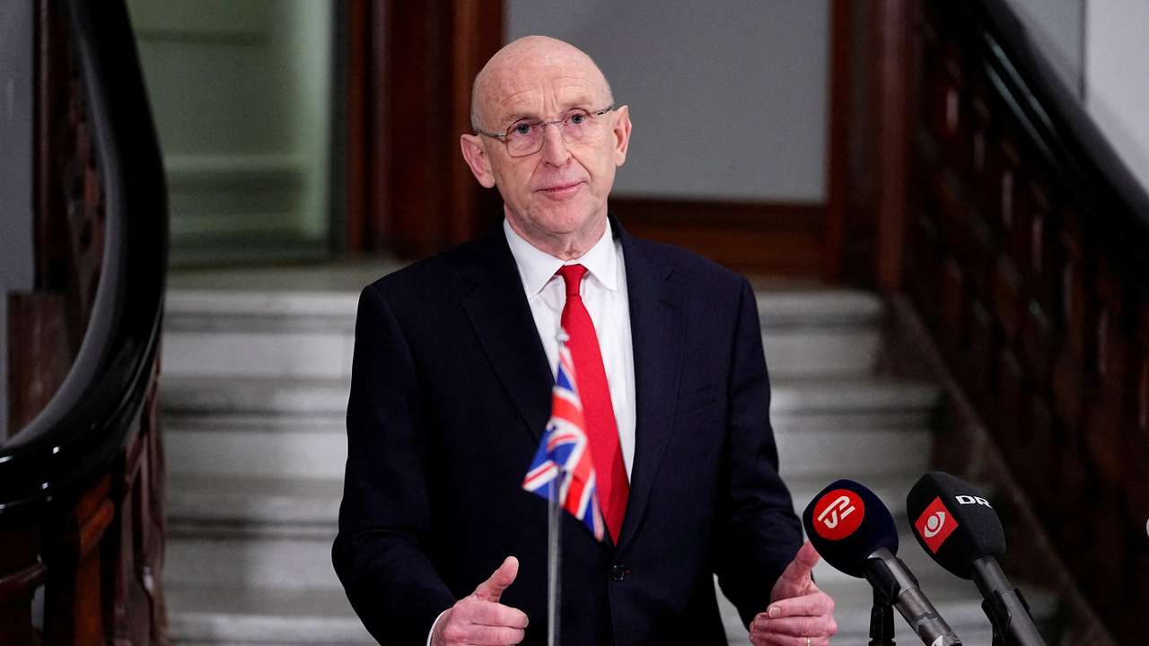 FILE PHOTO: Danish Defense Minister Poulsen and the British Defense Minister Healey attend a press conference at the Ministry of Defense in Copenhagen