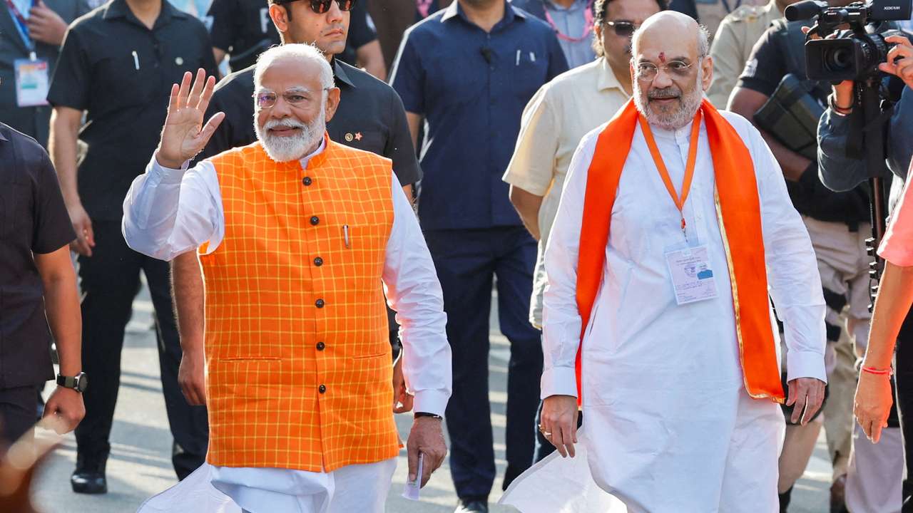 FILE PHOTO: India's Prime Minister Narendra Modi (L) walks alongside Amit Shah, Indian Home Minister