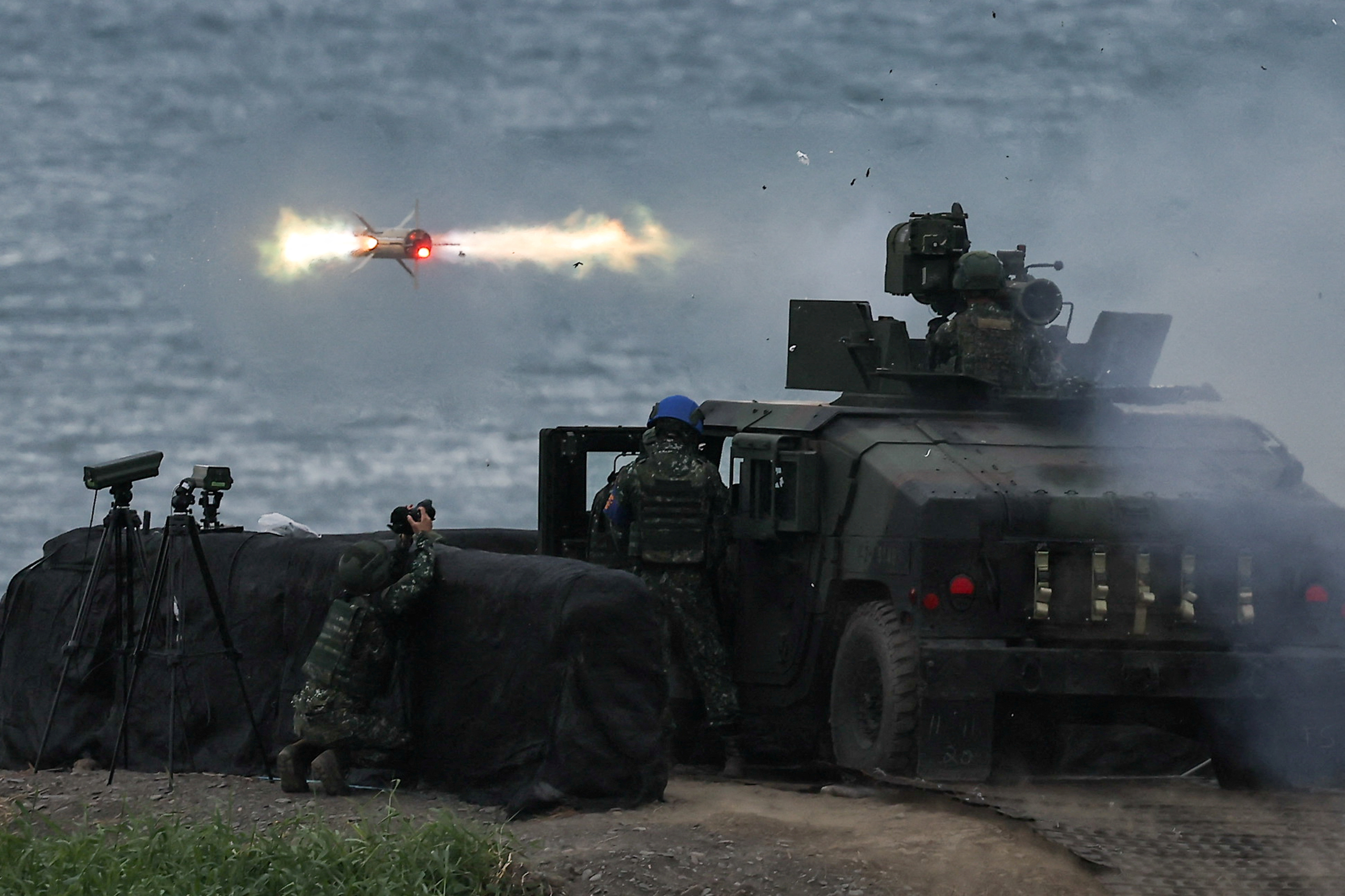 FILE PHOTO: A US-made TOW-2A wire-guided anti-tank missile is launched by Taiwanese soldiers from a M1167 TOW carrier vehicle