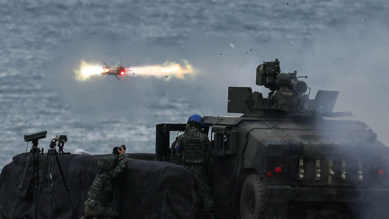 FILE PHOTO: A US-made TOW-2A wire-guided anti-tank missile is launched by Taiwanese soldiers from a M1167 TOW carrier vehicle