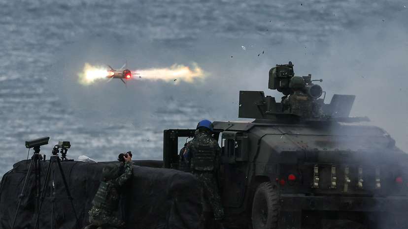 FILE PHOTO: A US-made TOW-2A wire-guided anti-tank missile is launched by Taiwanese soldiers from a M1167 TOW carrier vehicle