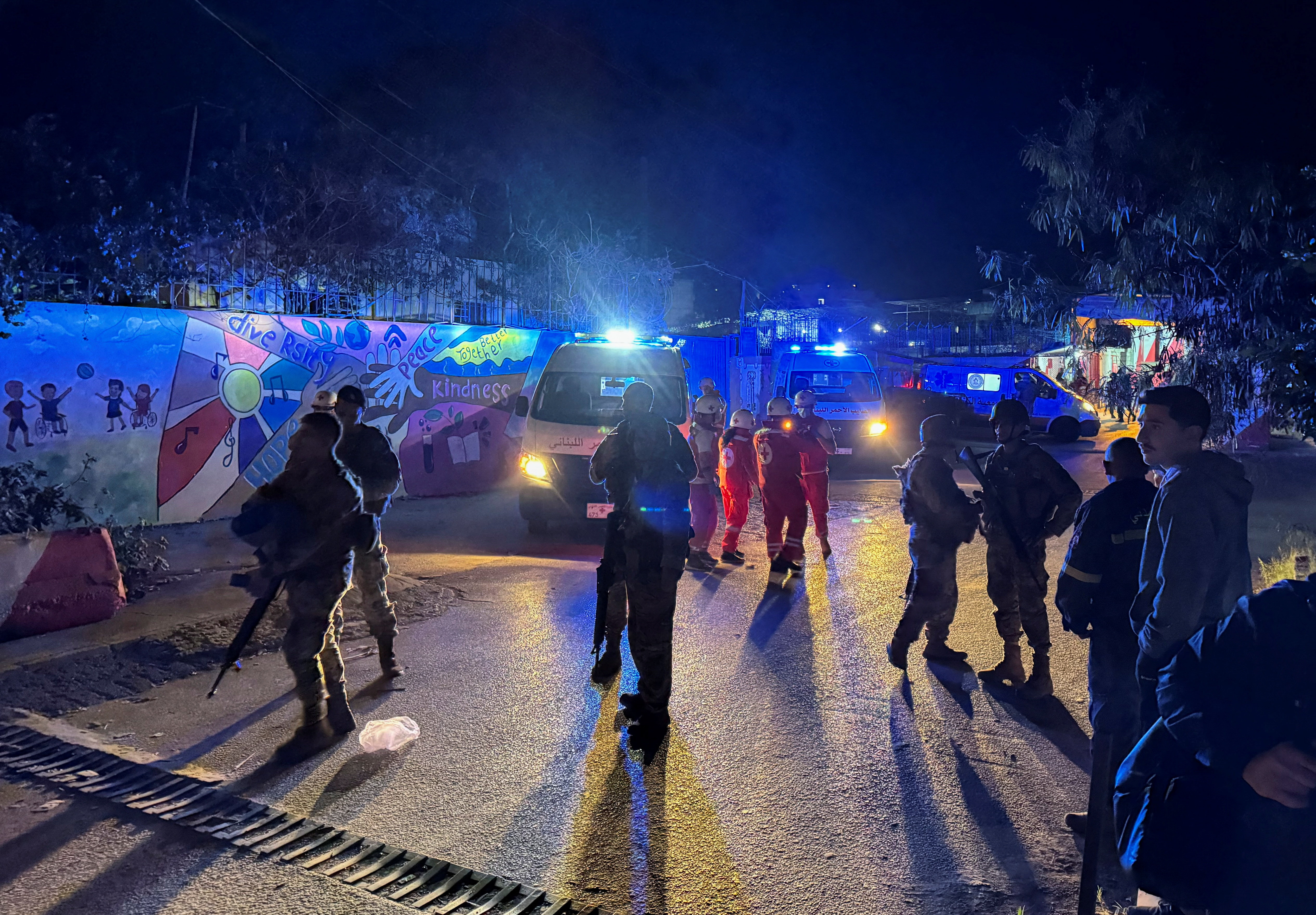 Members of the Lebanese army gather at the entrance of Ain al-Hilweh Palestinian refugee camp