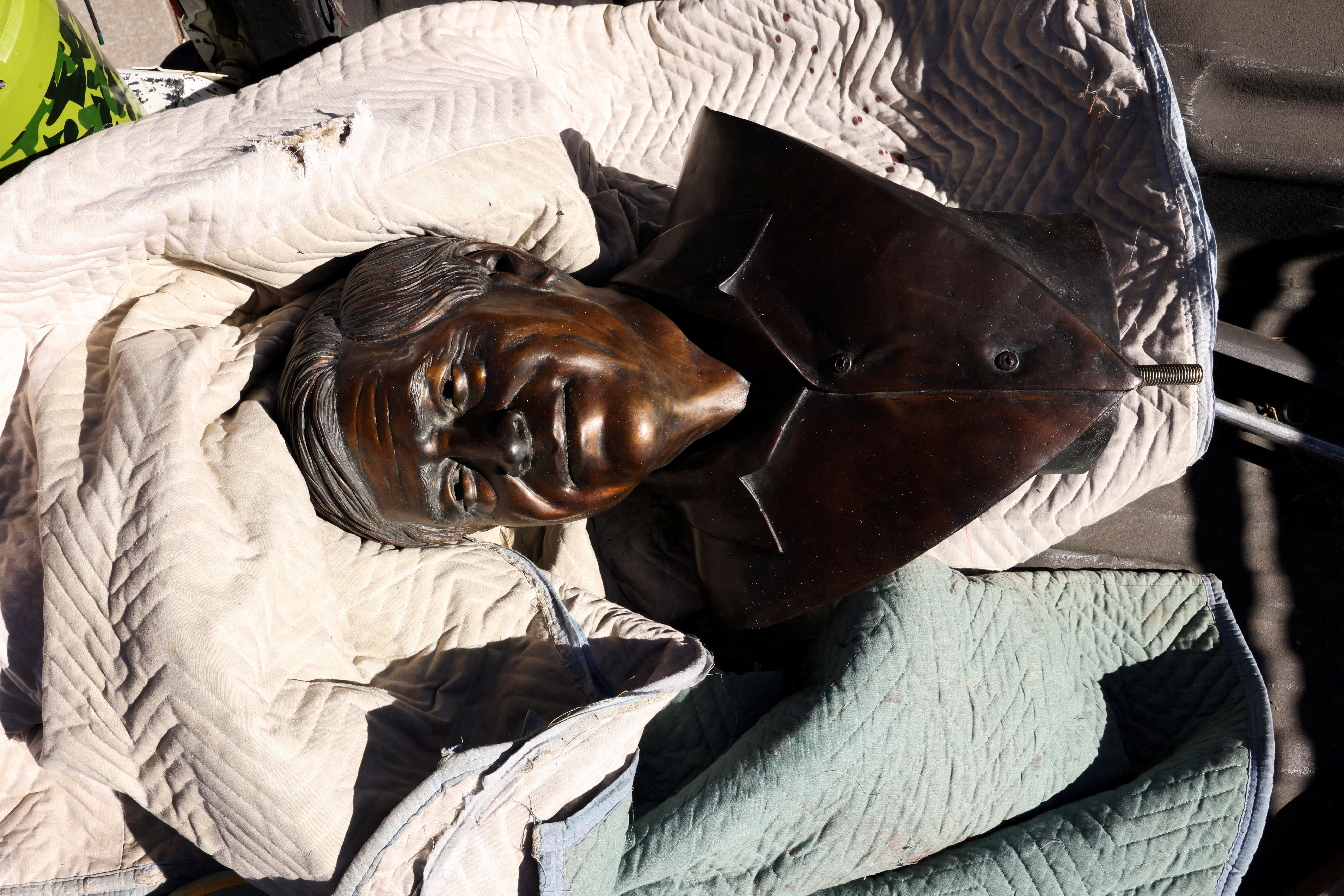 A bust of United Farm Workers union co-founder Cesar Chavez sits in the back of a Denver Parks and Recreation pickup truck following its removal from Cesar Chavez Park