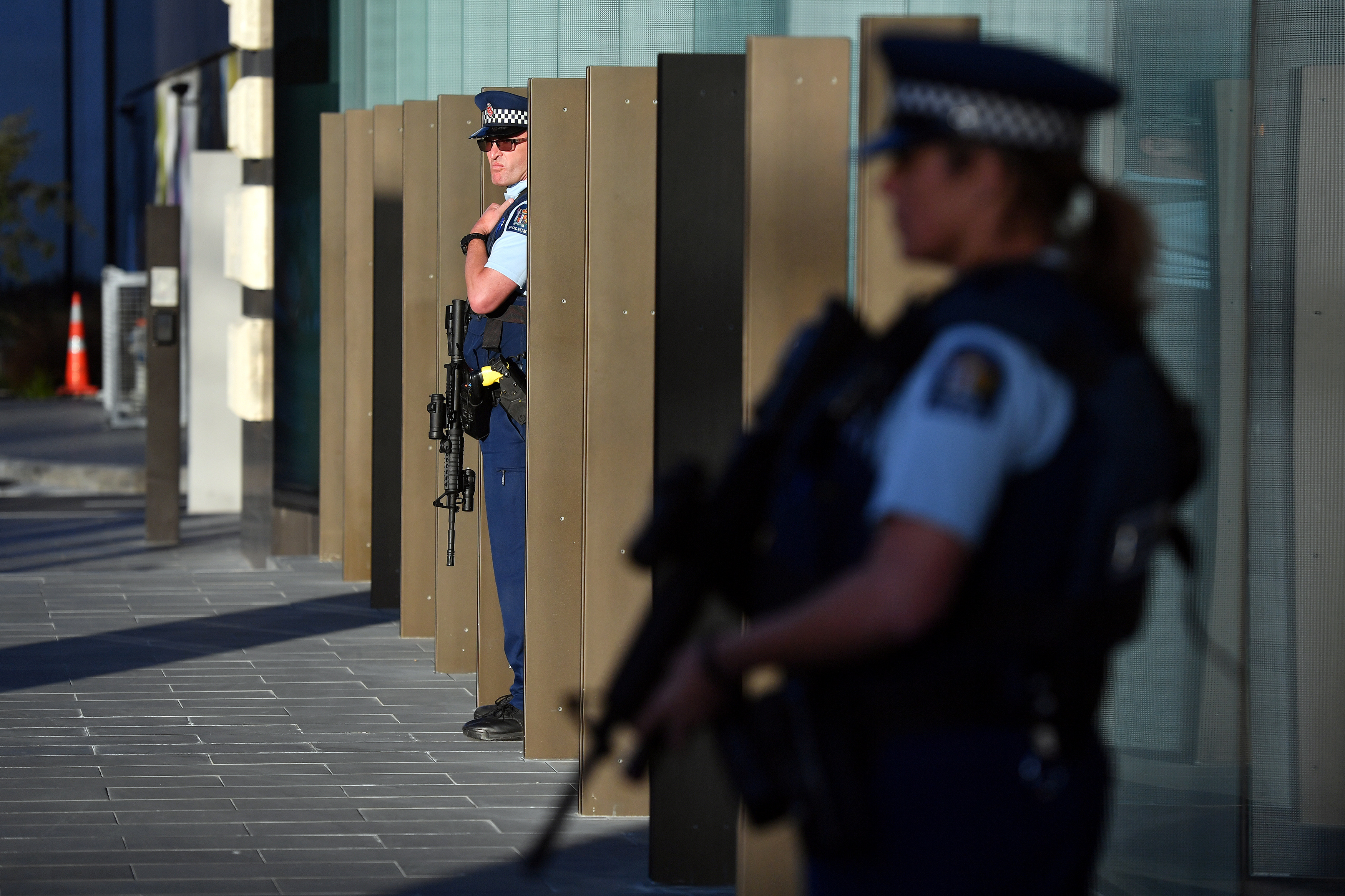 Police officers stay alert during Britain's Prince William's visit to the Justice and Emergency Services Precinct in Christchurch