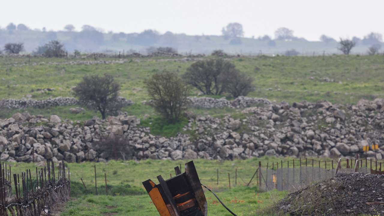 The tail fin of a large missile protrudes from a field, following barrages of missiles from Iran towards Israel, amid the U.S.-Israel conflict with Iran, in the Israeli-occupied Golan Heights