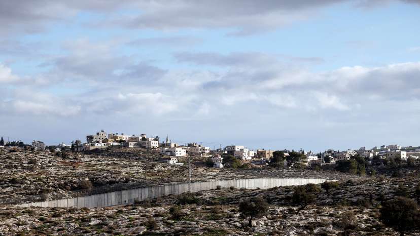 FILE PHOTO: A view of the southern part of the Israeli-occupied West Bank and the concrete barrier wall separating Israel and the West Bank, as seen from near Kibbutz Lahav