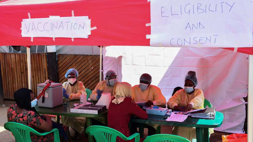 Ugandan doctors attend the contacts of a patient who had tested positive, during the launch of the vaccination for the Sudan strain of Ebola virus, in Kampala