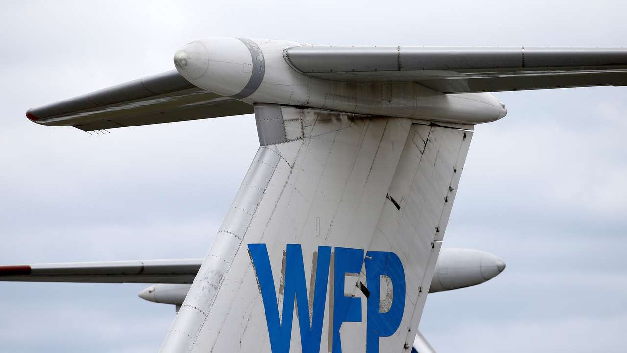 Logo of the World Food Programme humanitarian organization is seen on a plane at the National Airport Minsk